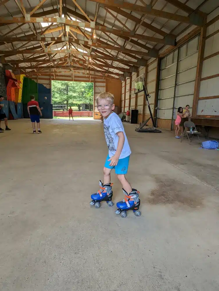 Kid roller skating indoors