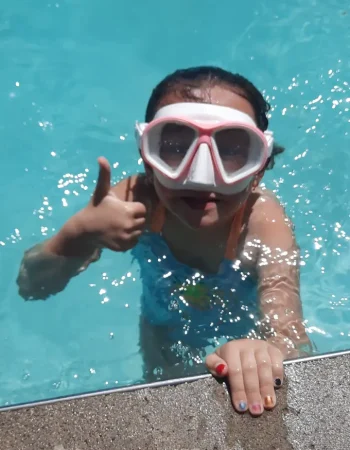 Kid Giving Thumbs up from pool